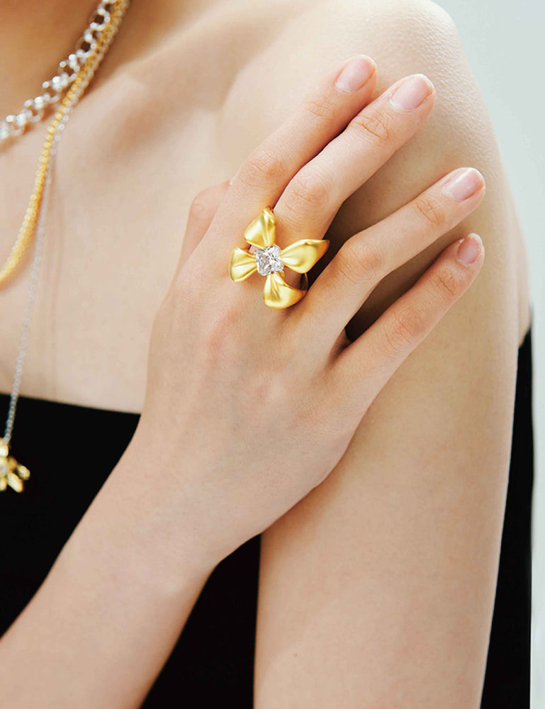 FOUR-CLAW RING