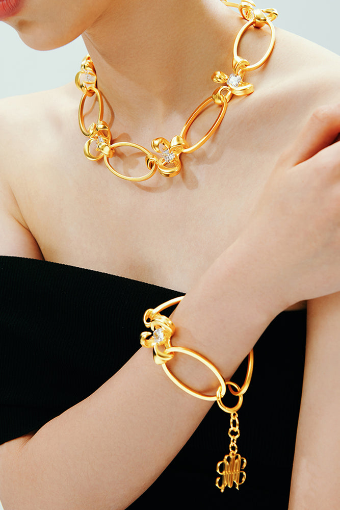 MULTI-LEVEL FLOWERS TAG BRACELET